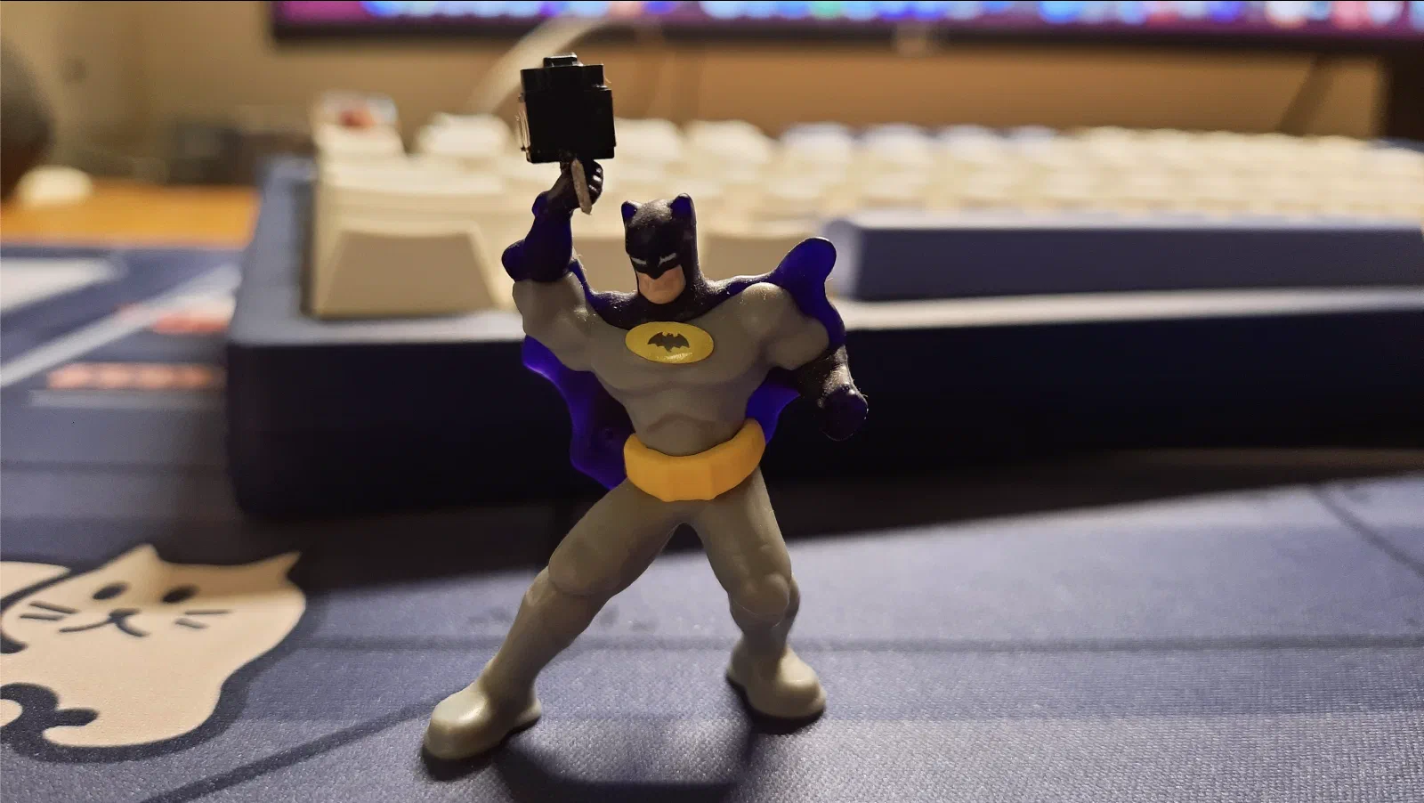 Batman holding the removed mouse switch